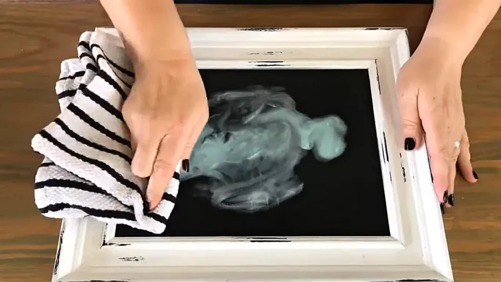 Cleaning chalkboard with dry cloth