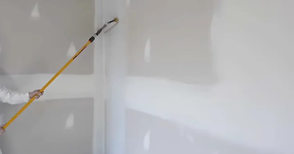 Applying primer on drywall